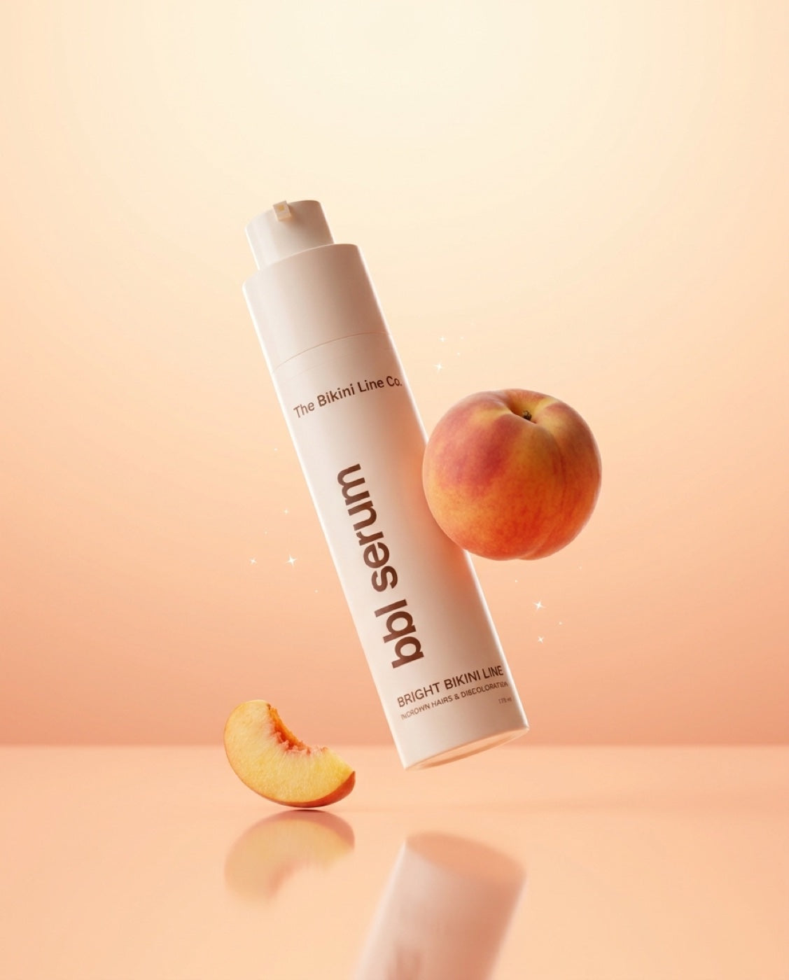 BBL Serum floating beside a fresh peach
